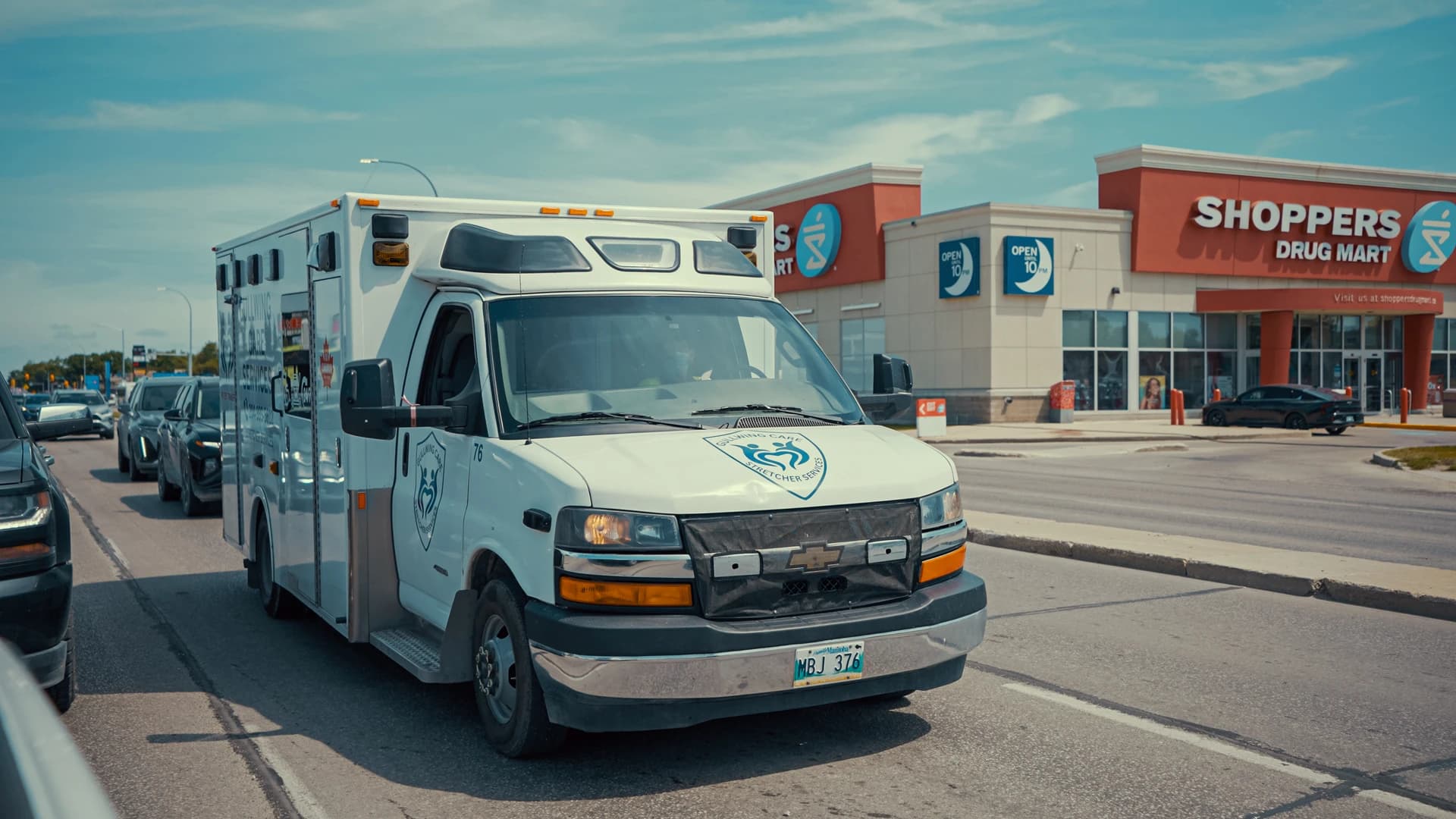 Gullwing Care vehicles parked outside a healthcare facility