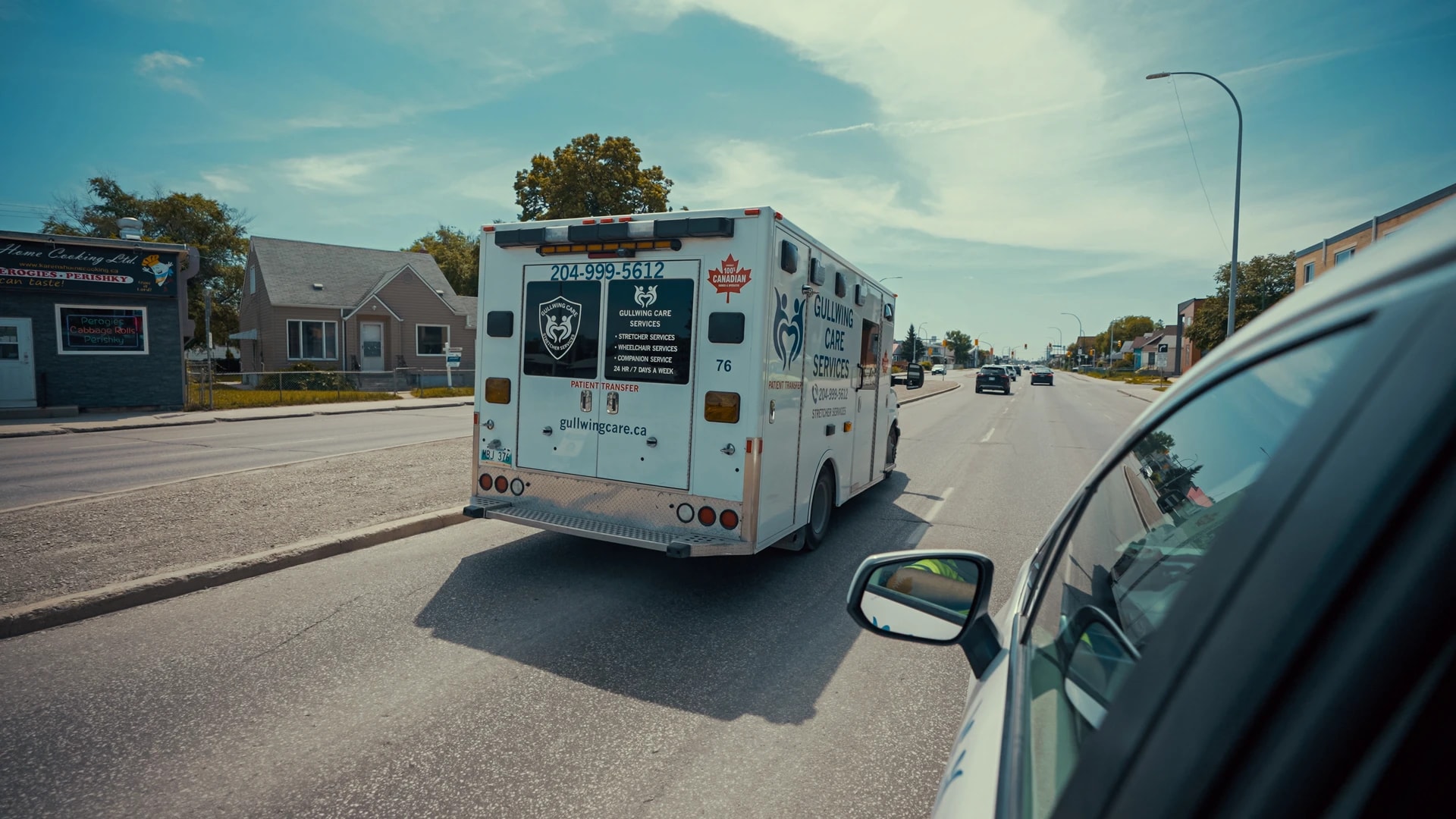 A Gullwing Care transport vehicle travelling through Winnipeg