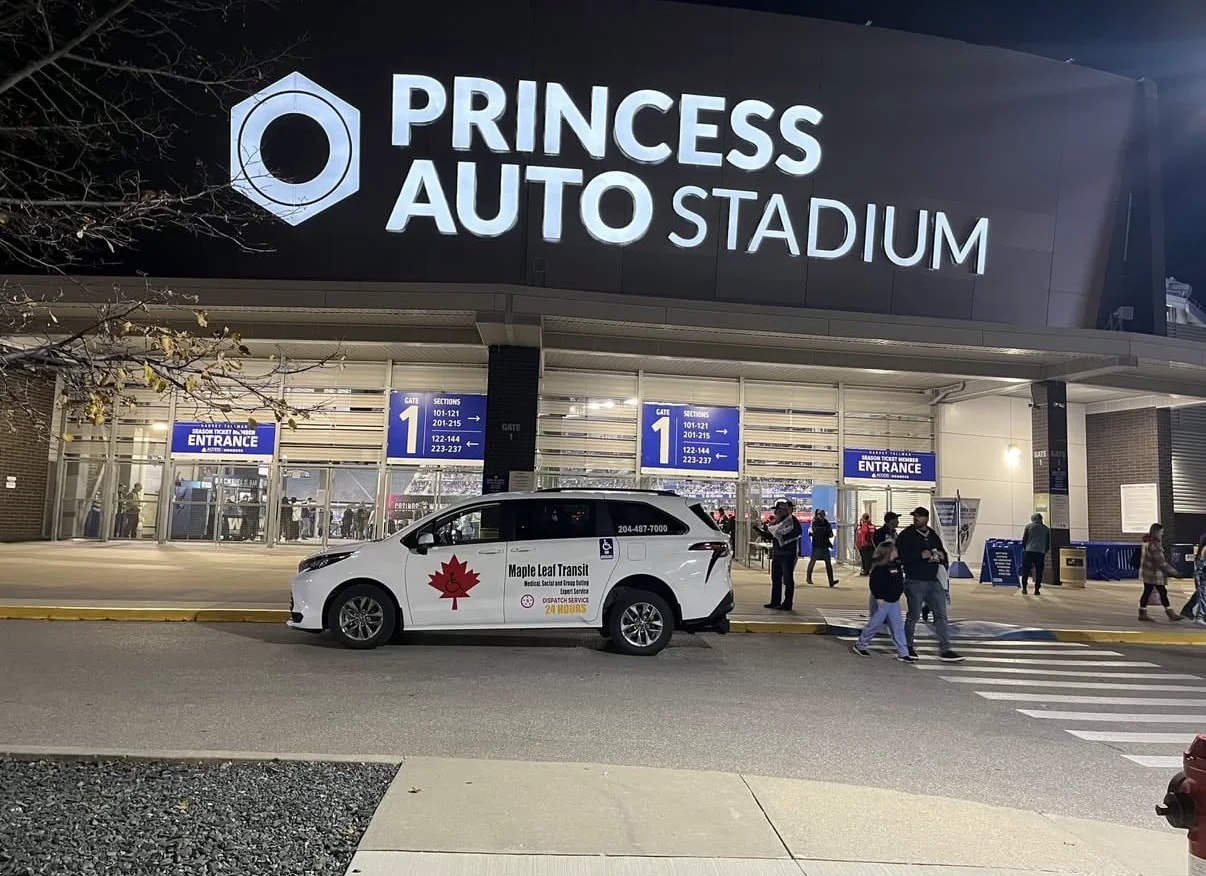 Maple Leaf Transit minivan outside Princess Auto Stadium